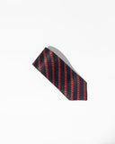 Introducing the Silk Tie by FashionInternational: a luxurious black necktie made from pure silk, showcasing an elegant brand pattern of diagonal red chains on a simple white backdrop.