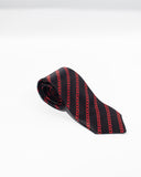 This sophisticated Silk Tie by FashionInternational showcases a stylish black necktie adorned with a red chain design on a crisp white background, highlighting an elegant Italian pattern. Expertly crafted from pure silk, it exudes timeless sophistication and charm.