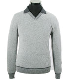 An Italian Fashion International cashmere polo sweater with ribbed collar and cuffs on a mannequin.