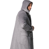 The man is wearing a Sartore duffel coat made of Italian wool.