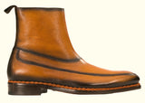 A pair of Corso boots from Fashion International with handmade brown soles.