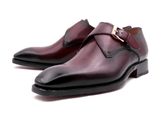 A pair of Edward Sr. burgundy leather monk shoes featuring a Goodyear welt construction and buckle by Ugo Vasare.