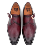 A pair of men's Edward Sr. Monks shoes in burgundy with black buckle by Ugo Vasare.