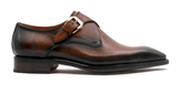 An Edward Sr. brown leather shoe with a buckle on the side featuring Goodyear welt construction by Ugo Vasare.