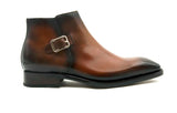 A handmade men's Ugo Vasare Americano brown leather ankle boot with a buckle and leather upper.