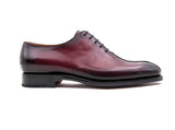 A men's burgundy derby shoe made of calfskin leather, hand stitched with a Goodyear welt construction, the Derrick by Ugo Vasare on a white background.