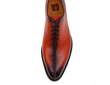 A pair of Ugo Vasare men's Derrick shoes in orange leather, hand-stitched with Goodyear welt construction.