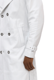 A man donning a full length Barya White Leather Trench Coat made of lambskin leather.
