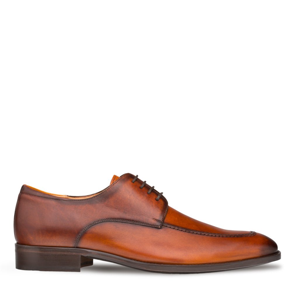A handmade men's brown Coventry derby shoe with a classic apron design, crafted from leather, presented on a white background. (Brand Name: Mezlan)