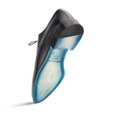 A black Enterprise shoe with blue soles on a white background, made with calfskin, by Mezlan.