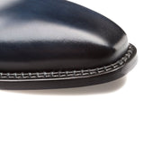 A close up of a blue Mezlan Enterprise calfskin shoe.