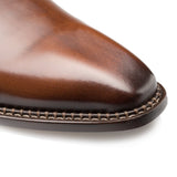 A close up of a plain toe balmoral brown leather dress shoe made with calfskin, the Mezlan Enterprise.