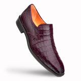 A Mezlan men's purple Crocodile Plain Toe Slip-On loafer featuring a unique texture on a white background.